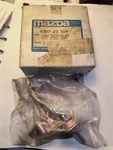 New Genuine Oem Mazda 8397-23-324 Choke Piston Holder With Box. Fixed Price $19.95.